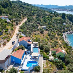 an aerial view of a house with a swimming pool at Villa Love house in Vela Luka