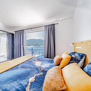 a bedroom with a large bed and a large window at Villa Love house in Vela Luka +46 photos