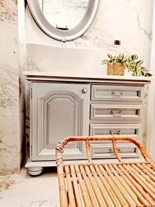 a bathroom with a sink and a mirror and a bench at Luxury Studio with Balcony in Sunny Beach