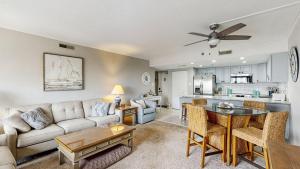 a living room with a couch and a table at Ocean Block retreat with easy beach access & shared pools in Ocean City