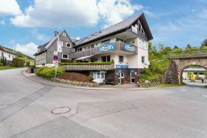 a building on the side of a road at Pistenblick in Willingen