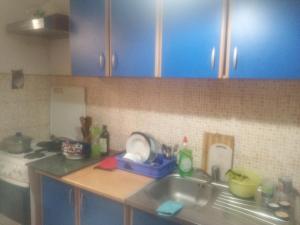a kitchen with a sink and a counter top at RoomForRent in Konjic