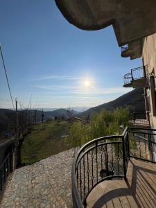 a balcony with a view of the mountains at Selim Guesthouse 2 in Lybeshë