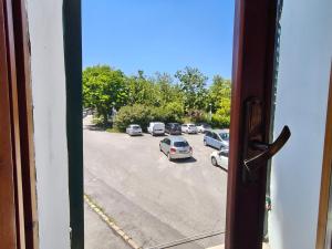 a view from a window of a street with cars at Suite Rosso 24 in Iesi