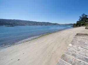 a view of the beach from the fortress at Apartamentos turísticos O Estaleiro in Moaña