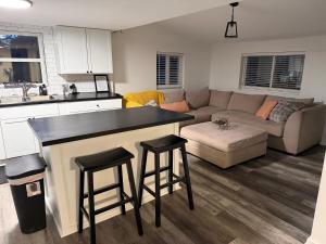 a kitchen and living room with a couch and a table at Buckeye Lake Getaway in Thornville