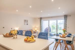 a kitchen and living room with a table and chairs at 2 Bed in Sandown oc-90013 in Sandown