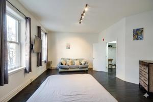 a living room with a couch and a table at The Havana Lofts in Philadelphia