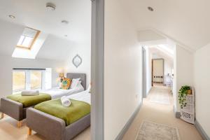 a bedroom with two beds and a hallway at 6 Bed in Holsworthy oc-89218 in Merryfield