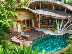 an aerial view of a villa with a swimming pool at Ulaman Eco Luxury Resort in Tabanan