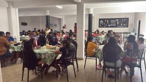 a group of people sitting at tables in a room at Hanna in Mar del Plata