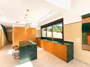 a kitchen with a sink and a counter top at Luxury Villa Galaxy Beach 12min walk 15m pool in Calpe