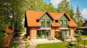 a house with an orange roof at Rudziaszka in Otole