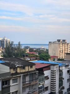 a view of a city with buildings and the ocean at Luxury Comfort House in Maputo