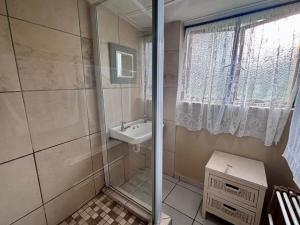 a bathroom with a shower and a sink at Siesta Island #5 in Amanzimtoti +13 photos