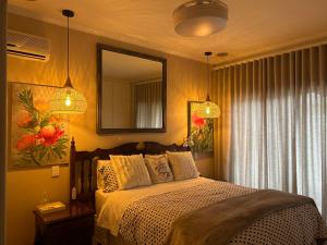 a bedroom with a bed and a mirror at Bonne Esperance in Tyger Valley +11 photos