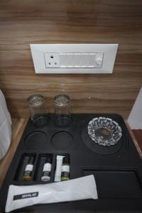 a stove top with some drinks on top of it at Hotel Subarnrekha Heritage- Lalpur, Kanke Road in Rānchī