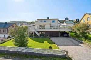 an aerial view of a house with a yard at Modern Arctic Apartment in Tromsø
