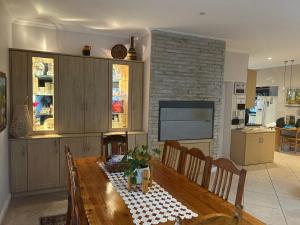 a kitchen with a wooden table in a room at Bonne Esperance in Tyger Valley