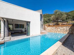 a villa with a swimming pool and a house at Notos Club in Kaş