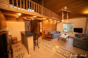 a living room with a couch and a table at Beel Hills in Khallat al Mutayn