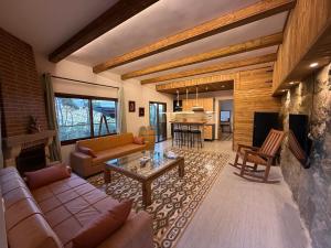 a living room with a couch and a table at Beel Hills in Khallat al Mutayn