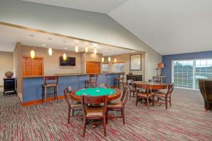 a living room with tables and chairs and a bar at WorldMark Blaine in Birch Bay