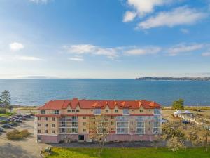 an aerial view of a building next to the water at WorldMark Blaine in Birch Bay