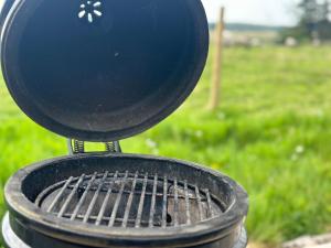 a grill with a blue top on top of it at The Truck with private hot tub -Garvagh retreats in Ballynameen