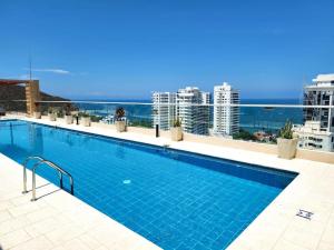 a swimming pool on the roof of a building at Salguero suites resort apartamento in Gaira