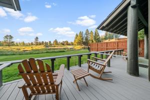two chairs and a table on a porch at Sunriver Resort in Sunriver