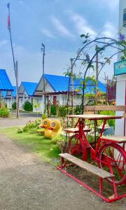 a park with a picnic table and a red bike at Route652 Resort Singburi in In Buri +13 photos
