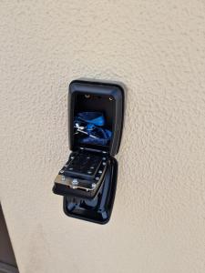 a cell phone in a holder on a wall at 4 Seasons studio in Marinha das Ondas