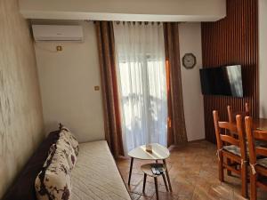 a living room with a couch and a table at Apartments Popovic 2 in Kotor