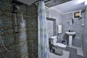 a bathroom with a toilet and a sink at Riad Zayna Fes in Fez +74 photos
