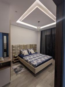 a bedroom with a large bed in a room at MahdiaRafeha in Mahdia