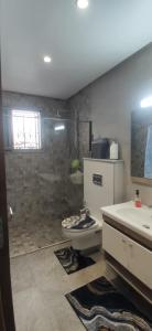 a bathroom with a shower and a toilet and a sink at MahdiaRafeha in Mahdia