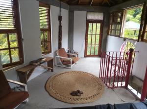 a living room with a large rug on the floor at Kaiche in Trafalgar