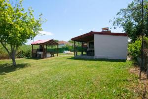 a view of a house with a yard at KALLIOPIs HOUSE in Paralia Katerinis
