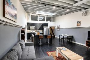 a living room with a couch and a table at The Havana Lofts in Philadelphia