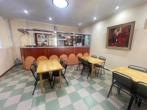 a restaurant with tables and chairs and a counter at Жастар in Astana +31 photos