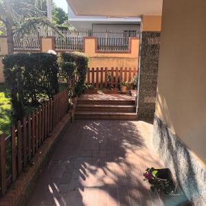 a walkway in front of a house with a fence at Villa Vanessa in Spoltore