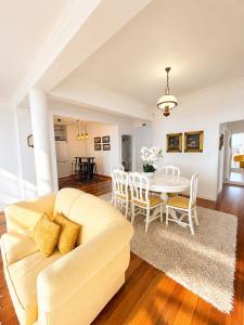 a living room with a couch and a table at A Velha Casa Caboz in Ponta do Sol