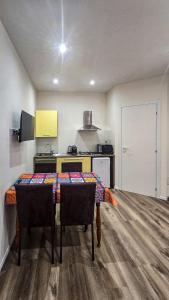a kitchen with a table and chairs in a room at B&B di Cristina in Conegliano +14 photos