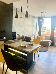 a kitchen and living room with a table and chairs at Balkan tower-Rest in Gabrovo