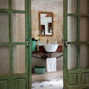 a bathroom with a sink and a mirror at Casa rural en Buendía -la Galera con 4 dormitorios in Buendía +34 photos