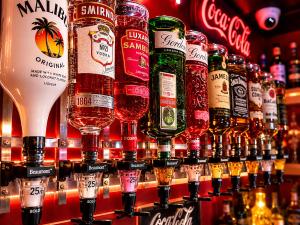 a bar with a bunch of bottles of alcohol at The Kings Cross Hotel in Blackpool