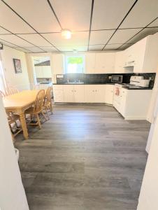 a kitchen and dining room with a table and chairs at 1 central ave in Old Orchard Beach
