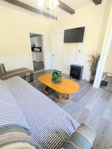 a living room with a bed and a table at 1 central ave in Old Orchard Beach