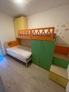 a small room with a bunk bed and a bunk bed frame at Casa Estense in Lido degli Estensi